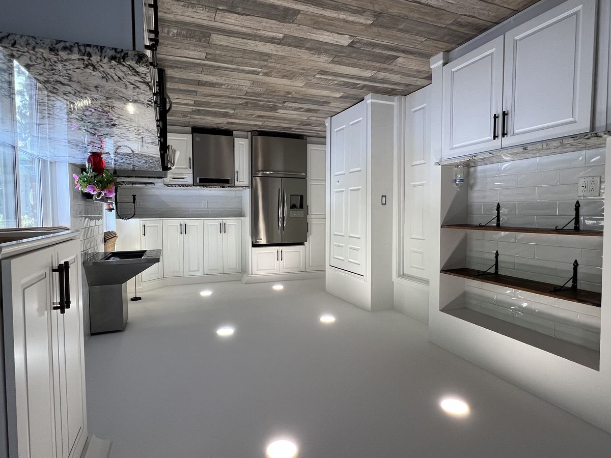 Kitchen pantry area with open shelving, subway tile, and two large pantry closets