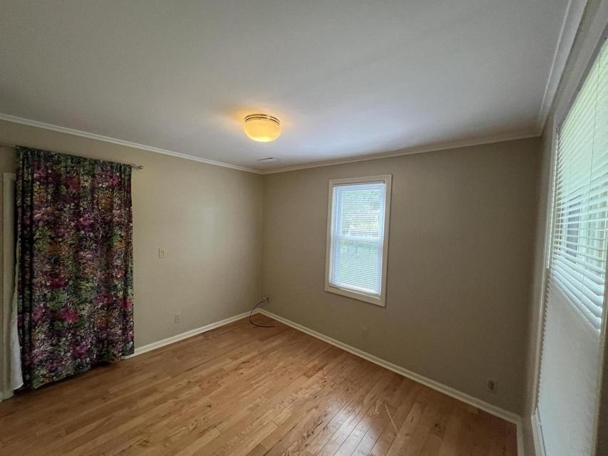 Main-floor bedroom with wood ceiling