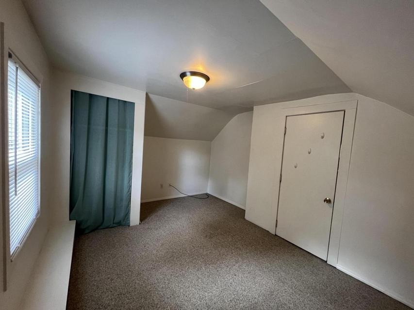 Upper bedroom with sloped ceiling