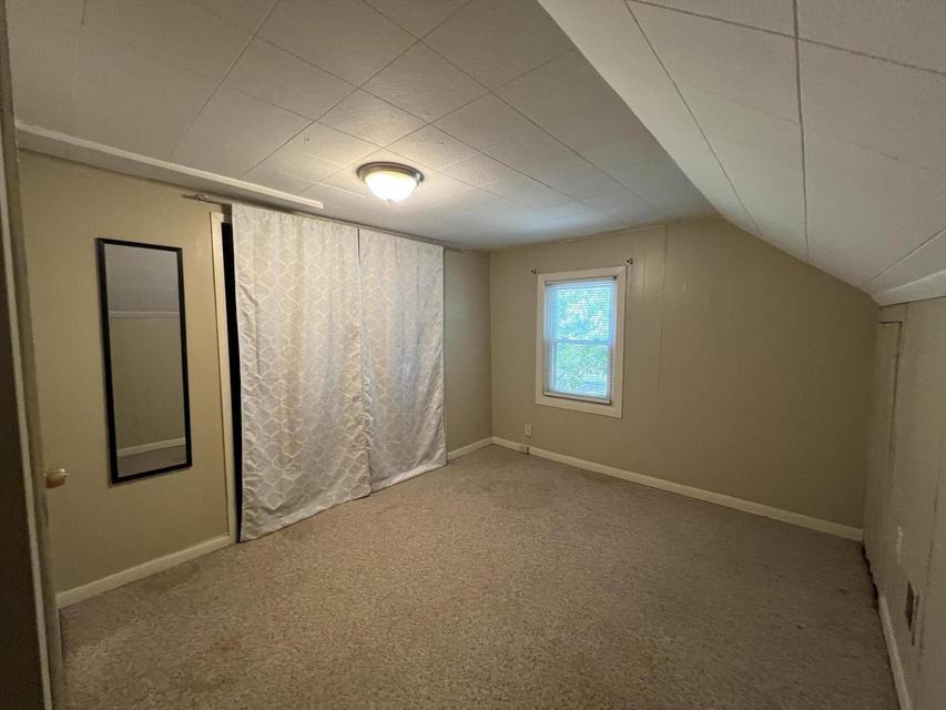 Upper bedroom with curtain